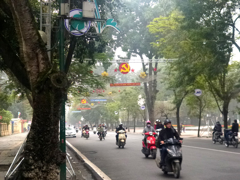 scooters, bikes hanoi, vietnam, communist flags