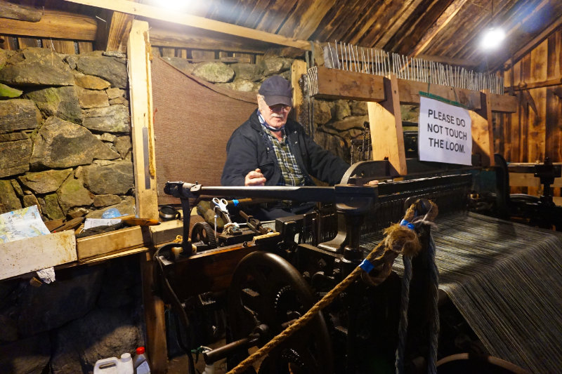 Ali with the tweed loom at Gearrannan Blackhouse Village, Isle Of Lewis, Scotland