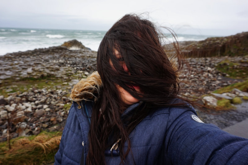 Windswept at Giant's Causeway, Northern Ireland. You cannot see my face because of my hair.