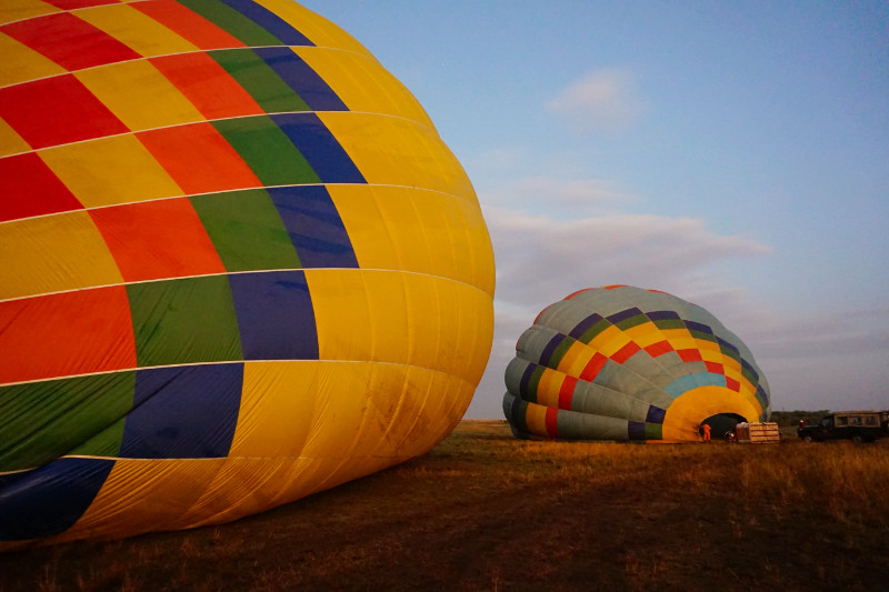 Blowing up the hot air balloons, Maasai Mara, Kenya