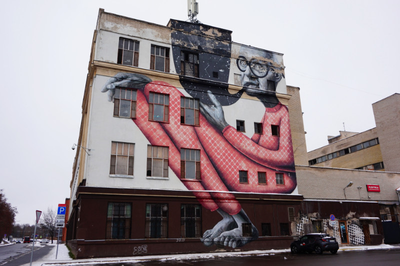 Street art in Kaunas, Lithuania. A wise old man in pyjamas smoking a pipe.