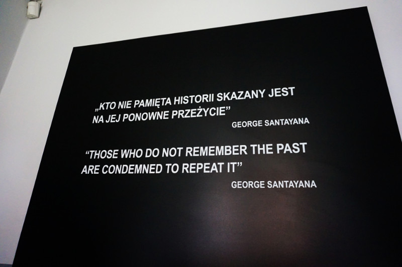 Sign reading "those who do not remember the past are condemned to repeat it" - George Santayana. Auschwitz, Poland