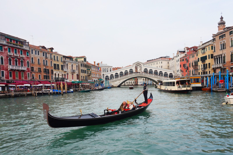 Grand Canal with Rialto Bridge and gondola, Venice, Italy