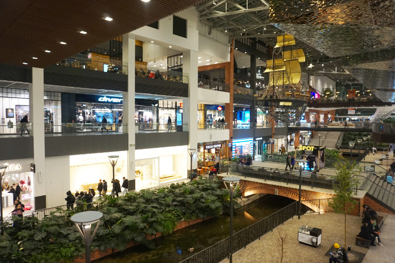 Forum shopping centre in Gdansk, Poland. It has a canal running through the centre and a ship floating above it!