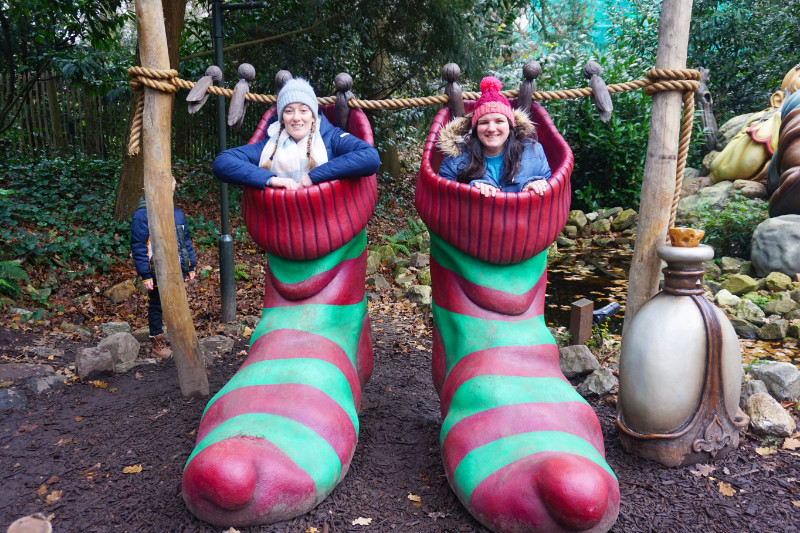 Fun at Efteling in the Netherlands. My friend and I are sat in giant green and red striped socks.