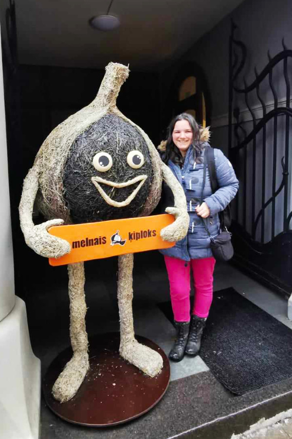 With a giant garlic, Riga, Latvia