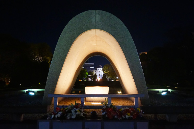 Hiroshima tribute with arch, eternal flame and the A-bomb dome, Hiroshima, Japan