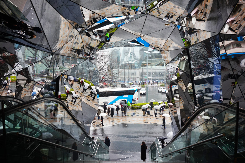 Omotesando shopping centre, Tokyo, Japan. The entrance is a cave of huge mirrors reflecting everything countless times.