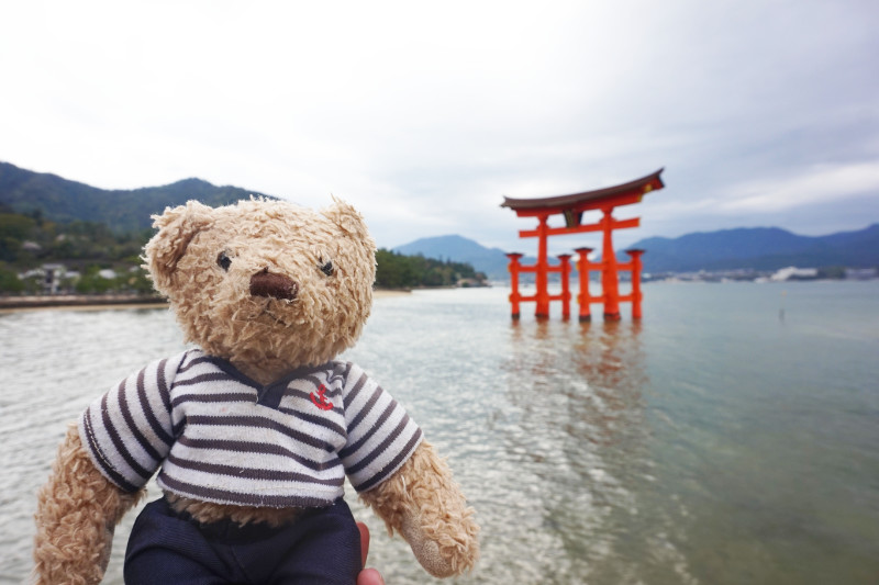 Gulliver with Itsukushima shrine torii gate on Miyajima Island, Japan