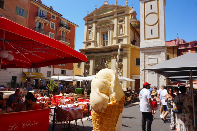 Place Rossetti, Nice, France. I'm holding up an ice cream (cone, two scoops) in front of Nice Cathedral