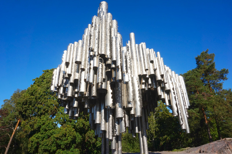 Sibelius Monument, Helsinki, Finland. It is a sculpture of large, silver vertical pipes stuck together in a haphazard shape.