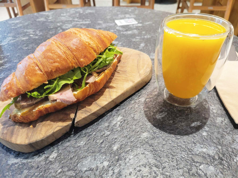 Lunch at Sincer Cafe, Chisinau, Moldova. It's a duck and pear croissant with a sea buckthorn drink!