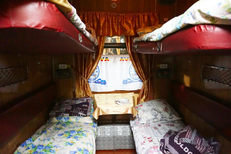 4 berth cabin the train from Bucharest to Chisinau, Moldova. There are two lower beds and two upper beds, with a net shelf and plug sockets