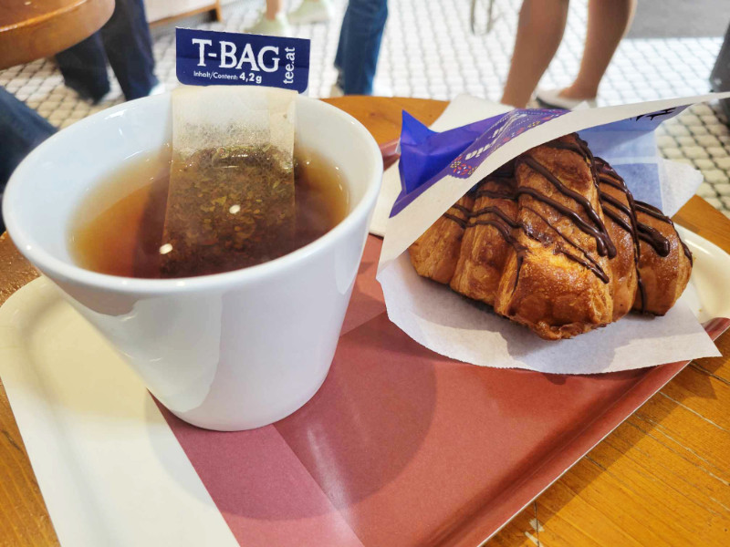Tea and chocolate croissant in Scovergăria Micăi, Bucharest, Romania
