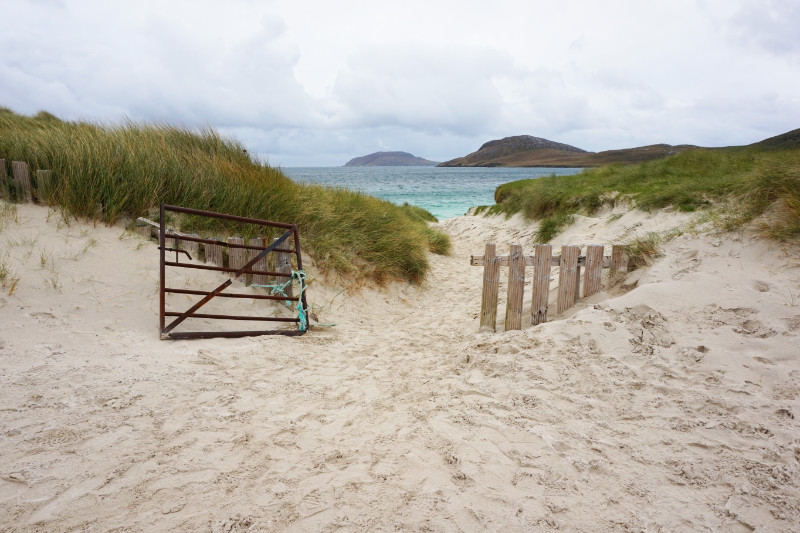 Traigh a Bhaigh beach with a gate opening onto it, Vatersay, Scotland