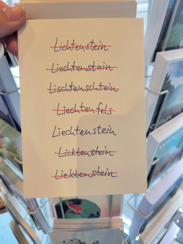 Liechtenstein postcard with lots of misspellings crossed out
