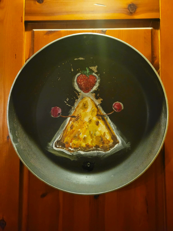 Toilet sign in Kompressor, Tallinn, Estonia. Toilet sign in Kompressor, Tallinn, Estonia. It's a triangular pancake with a salami head.
