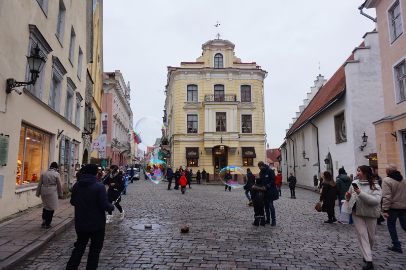 Maiasmokk cafe, Tallinn, Estonia. Someone is blowing huge bubbles in the foreground.