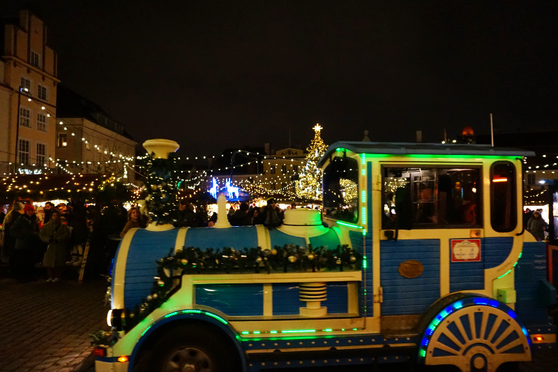 Train driving through Christmas market, Tallinn, Estonia
