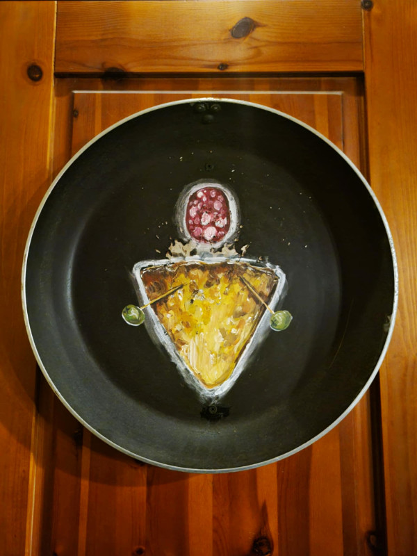 Toilet sign in Kompressor, Tallinn, Estonia. Toilet sign in Kompressor, Tallinn, Estonia. It's a triangular pancake with a salami head.